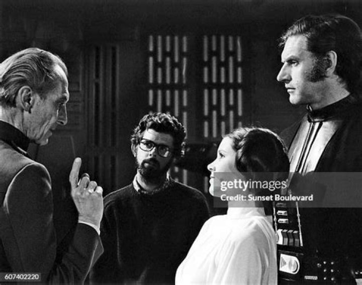 British actors Peter Cushing, David Prowse and American Actress Carrie Fisher with director, screenwriter and producer George Lucas on the set of his movie Star Wars: Episode IV - A New Hope. (Photo by Sunset Boulevard/Corbis via Getty Images)